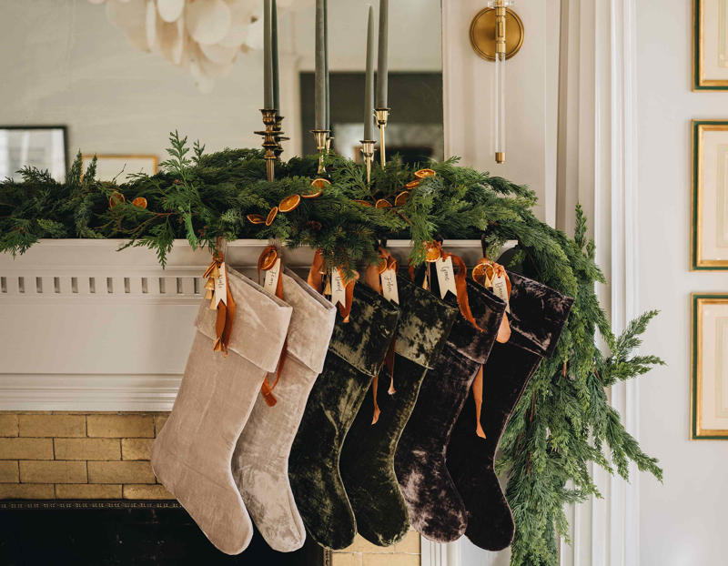 1. A Return to Classic Decor, 2. A Mix of New, Repurposed, and Secondhand, 3. Statement Bows, 4. Moody Colors, Neutrals, and Soft Metallics, 5. Mixed Greenery Wreaths, 6. Elevated Outdoor Decor, 7. Streamlined and Textured Christmas Centerpieces, 8. Simple Garlands and Trees