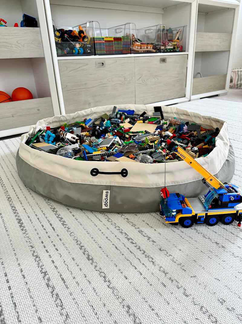 1. Clear plastic containers with lids , 2. Open-top plastic bins, 3. Lego mat-storage combos, 4. Color-coded lidded bins, 5. Cubbies, 6. Cute baskets, 7. Storage ottoman, 8. LEGO table, 9. Zipper mesh pouches, 10. Bead containers or tackle boxes, 11. Craftsman tool chest, 12. Under-the-bed storage bin