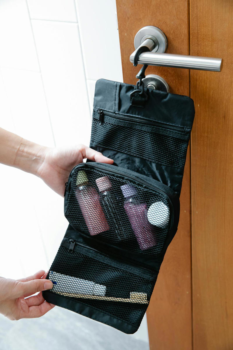 1. Universal travel adapter , 2. Compact external battery (power bank) , 3. Cable organizer and tech accessories , 4. Hanging toilet bag , 5. Travel pouch for documents and passport , 6. Noise-reducing headphones or earphones , 7. Foldable auxiliary bag (lightweight tote or backpack) , 1.Low-end inflatable neck pillow , 2. Suspended aircraft footrest , 3. Mini portable washing machine , 4. Ultra-visible ticket-covering belt , 5. Personal portable air purifier , 6. Bamboo travel cutlery in hard case , 7. Electronic suitcase scale