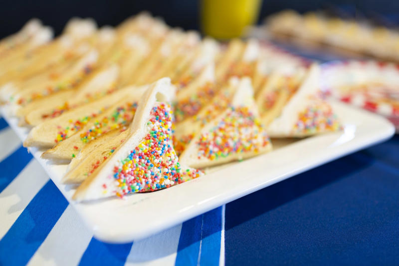 Fairy Bread A unique country with unique food, Emu anyone?, Witchetty Grubs, High in protein and an authentic food of the land, Macadamia nuts, A nut native to Australia, Damper is a traditional dish still enjoyed today, Balmain bugs, John Dory & chips, A dessert for a ballerina, Fairy Bread, Chiko Roll, Care for a crocodile leg?, Vegemite on toast, Cherry Ripe Bar, Tim Tams, ANZAC biscuits, Cheese and bacon roll, Grilled kangaroo, Barramundi