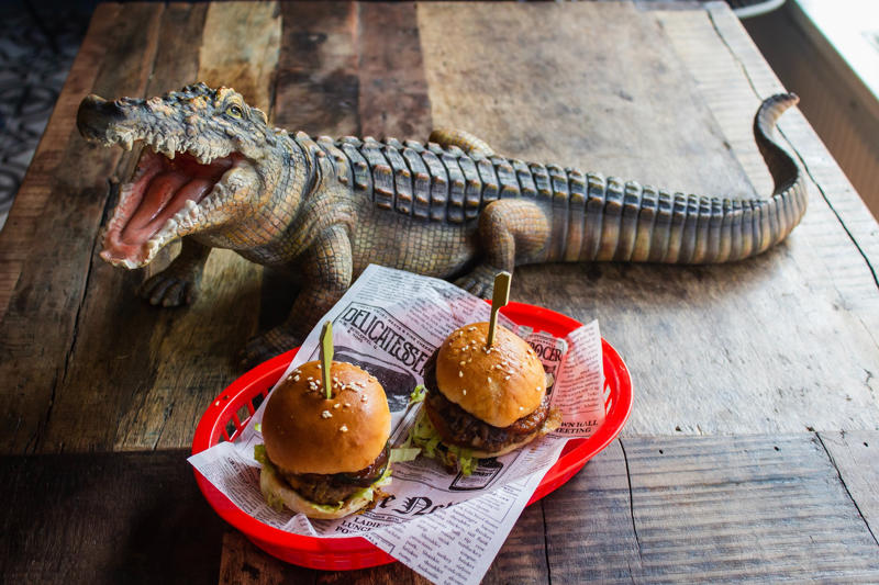 Crocodile A unique country with unique food, Emu anyone?, Witchetty Grubs, High in protein and an authentic food of the land, Macadamia nuts, A nut native to Australia, Damper is a traditional dish still enjoyed today, Balmain bugs, John Dory & chips, A dessert for a ballerina, Fairy Bread, Chiko Roll, Care for a crocodile leg?, Vegemite on toast, Cherry Ripe Bar, Tim Tams, ANZAC biscuits, Cheese and bacon roll, Grilled kangaroo, Barramundi
