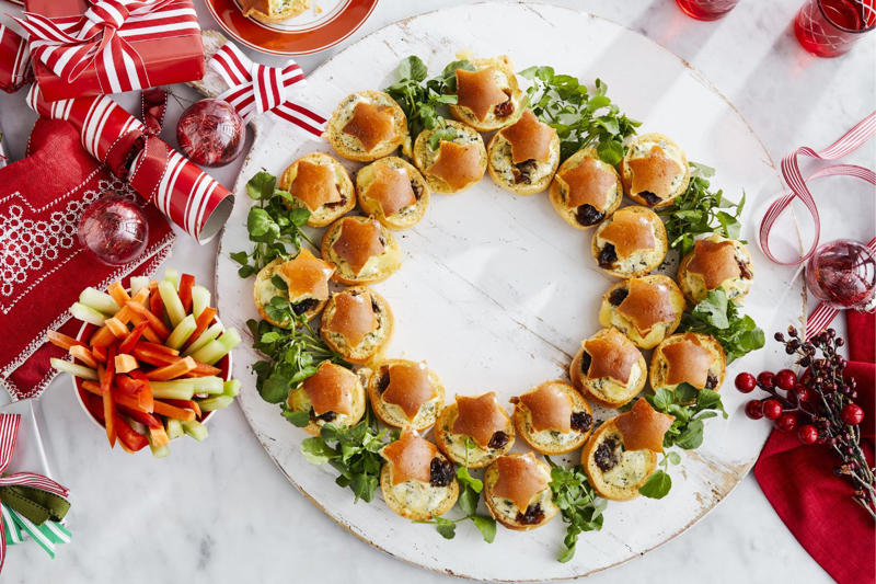 Sausage roll wreath with oozy camembert, Prawn, avocado and sesame bites, Sticky jerk lamb skewers, Pigs in blankets, Salmon croustades, Beef, fig and pistachio sausage pies, Lime and lemongrass barbecue prawn skewers, Arancini, Spinach, feta and lemon pasties, Popcorn chicken with aioli, Olive and goat’s cheese bites, Scrumptious grissini sticks , Cheese croquettes, Lamb, macadamia and mint sausage rolls, Caramelised onion tarts, Pork and cranberry-glazed meatball skewers, Rare roast beef canapes with horseradish cream, Quick and easy finger sandwiches, Cob dip wreath, Cheat’s mini quiches, Bang-Bang prawns with sweet chilli mayo, Easy peach and bocconcini flatbreads, Baked brie pull-apart cob loaf, Prawn cocktail sliders, Sticky-sweet air-fried cherry tomato crostini