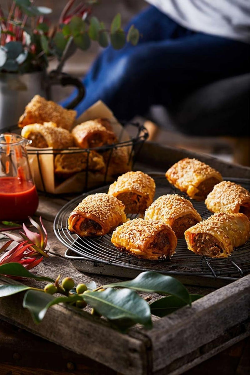 Sausage roll wreath with oozy camembert, Prawn, avocado and sesame bites, Sticky jerk lamb skewers, Pigs in blankets, Salmon croustades, Beef, fig and pistachio sausage pies, Lime and lemongrass barbecue prawn skewers, Arancini, Spinach, feta and lemon pasties, Popcorn chicken with aioli, Olive and goat’s cheese bites, Scrumptious grissini sticks , Cheese croquettes, Lamb, macadamia and mint sausage rolls, Caramelised onion tarts, Pork and cranberry-glazed meatball skewers, Rare roast beef canapes with horseradish cream, Quick and easy finger sandwiches, Cob dip wreath, Cheat’s mini quiches, Bang-Bang prawns with sweet chilli mayo, Easy peach and bocconcini flatbreads, Baked brie pull-apart cob loaf, Prawn cocktail sliders, Sticky-sweet air-fried cherry tomato crostini
