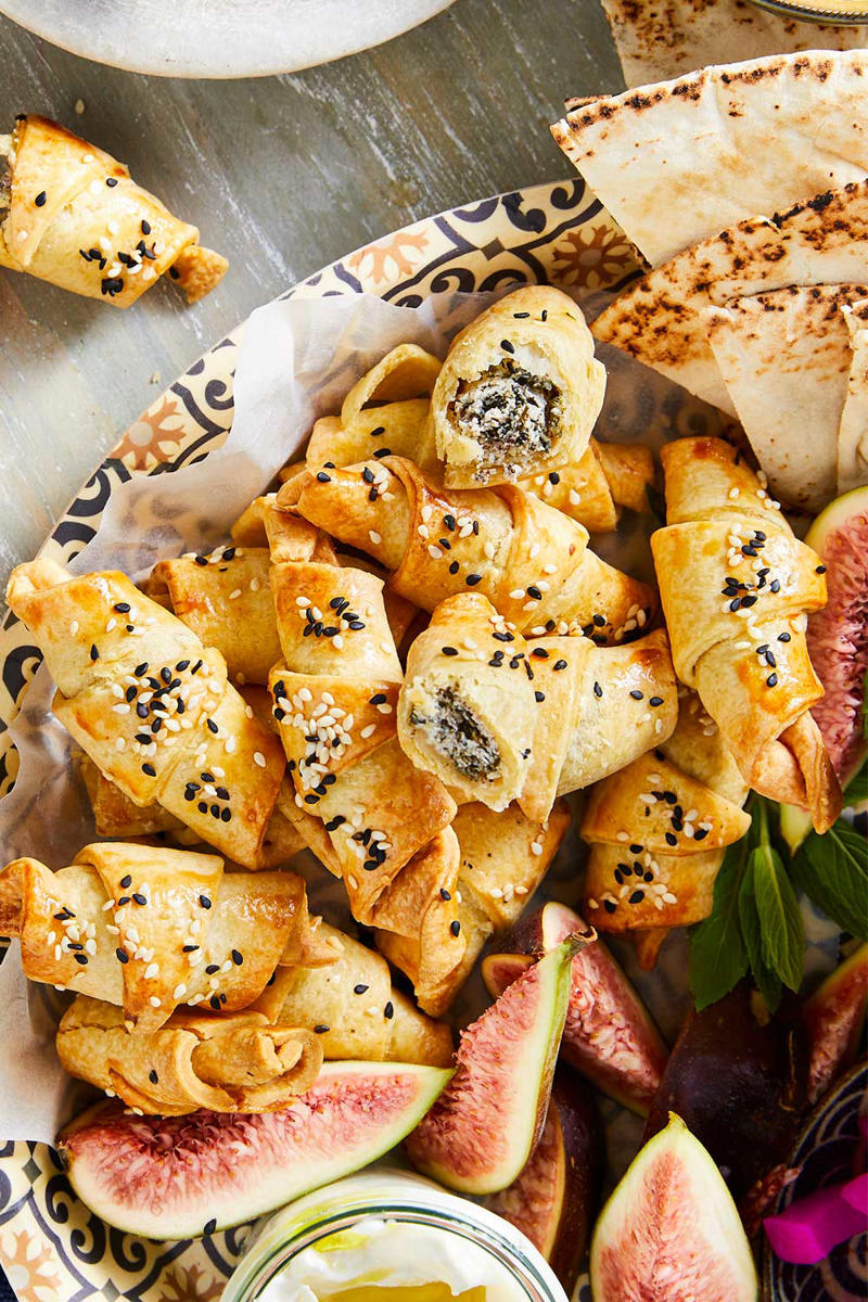 Sausage roll wreath with oozy camembert, Prawn, avocado and sesame bites, Sticky jerk lamb skewers, Pigs in blankets, Salmon croustades, Beef, fig and pistachio sausage pies, Lime and lemongrass barbecue prawn skewers, Arancini, Spinach, feta and lemon pasties, Popcorn chicken with aioli, Olive and goat’s cheese bites, Scrumptious grissini sticks , Cheese croquettes, Lamb, macadamia and mint sausage rolls, Caramelised onion tarts, Pork and cranberry-glazed meatball skewers, Rare roast beef canapes with horseradish cream, Quick and easy finger sandwiches, Cob dip wreath, Cheat’s mini quiches, Bang-Bang prawns with sweet chilli mayo, Easy peach and bocconcini flatbreads, Baked brie pull-apart cob loaf, Prawn cocktail sliders, Sticky-sweet air-fried cherry tomato crostini