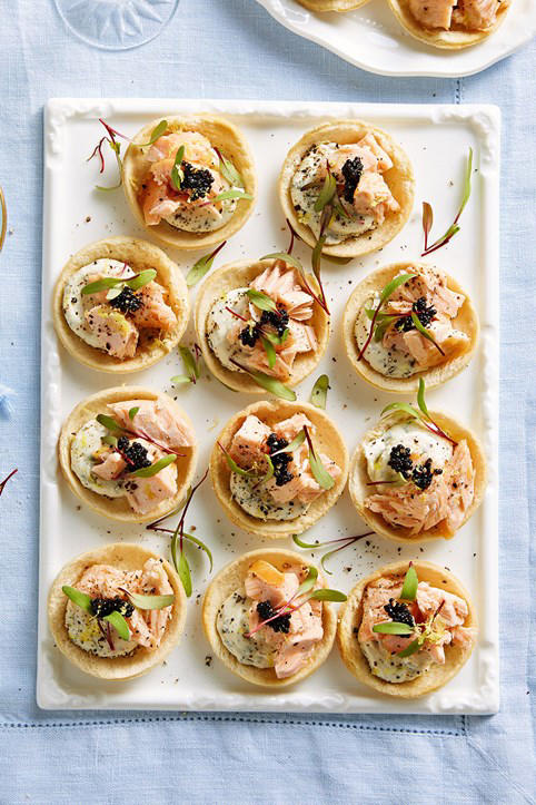 Sausage roll wreath with oozy camembert, Prawn, avocado and sesame bites, Sticky jerk lamb skewers, Pigs in blankets, Salmon croustades, Beef, fig and pistachio sausage pies, Lime and lemongrass barbecue prawn skewers, Arancini, Spinach, feta and lemon pasties, Popcorn chicken with aioli, Olive and goat’s cheese bites, Scrumptious grissini sticks , Cheese croquettes, Lamb, macadamia and mint sausage rolls, Caramelised onion tarts, Pork and cranberry-glazed meatball skewers, Rare roast beef canapes with horseradish cream, Quick and easy finger sandwiches, Cob dip wreath, Cheat’s mini quiches, Bang-Bang prawns with sweet chilli mayo, Easy peach and bocconcini flatbreads, Baked brie pull-apart cob loaf, Prawn cocktail sliders, Sticky-sweet air-fried cherry tomato crostini
