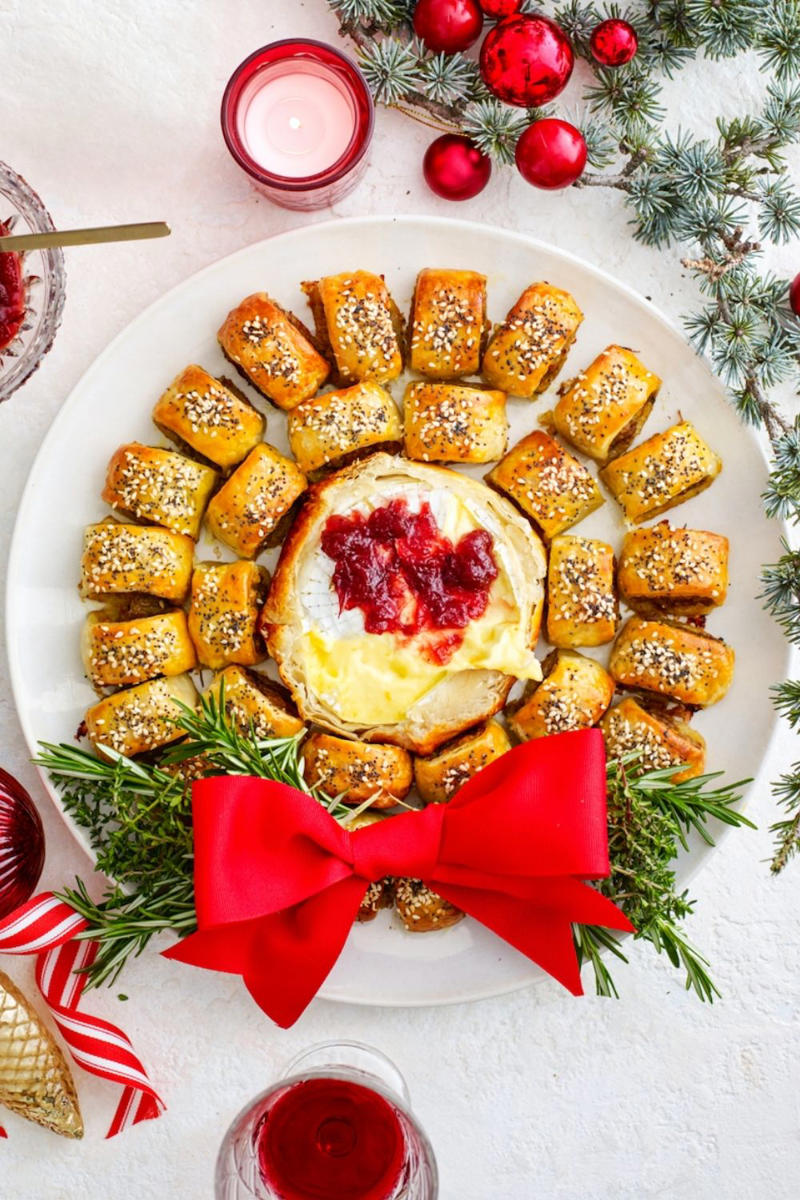 Sausage roll wreath with oozy camembert, Prawn, avocado and sesame bites, Sticky jerk lamb skewers, Pigs in blankets, Salmon croustades, Beef, fig and pistachio sausage pies, Lime and lemongrass barbecue prawn skewers, Arancini, Spinach, feta and lemon pasties, Popcorn chicken with aioli, Olive and goat’s cheese bites, Scrumptious grissini sticks , Cheese croquettes, Lamb, macadamia and mint sausage rolls, Caramelised onion tarts, Pork and cranberry-glazed meatball skewers, Rare roast beef canapes with horseradish cream, Quick and easy finger sandwiches, Cob dip wreath, Cheat’s mini quiches, Bang-Bang prawns with sweet chilli mayo, Easy peach and bocconcini flatbreads, Baked brie pull-apart cob loaf, Prawn cocktail sliders, Sticky-sweet air-fried cherry tomato crostini