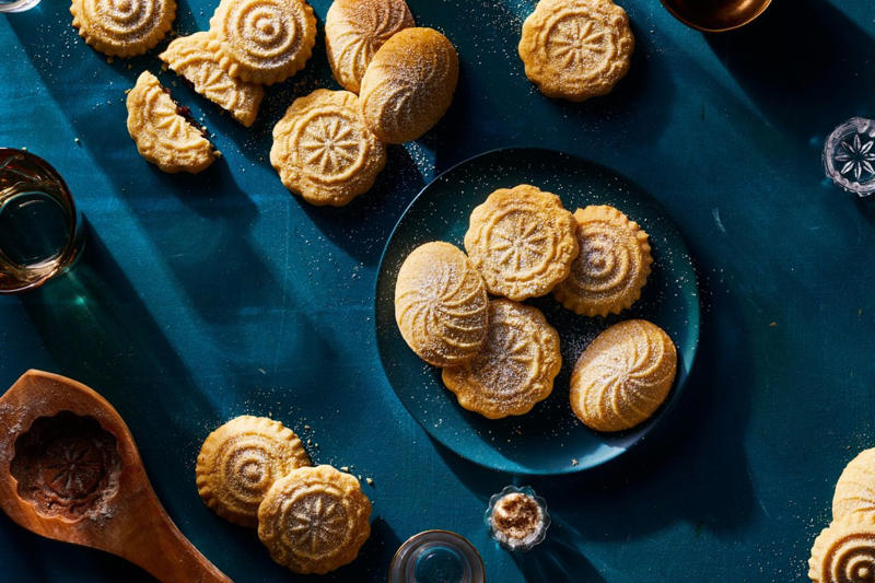 Easy Sugar Cookies, Cranberry Linzer Cookies, Peanut Butter Kiss Cookies, Pignoli Cookies, Maamoul (Lebanese Date Cookies), Mrs. Sigg's Snickerdoodles, Shortbread Cookies, Alfajores (Dulce de Leche Sandwich Cookies), Grandma's Gingersnap Cookies, The Best Rolled Sugar Cookies, Gingerbear Thumbprint Cookies, Grandma Minecci's Snowball Cookies, Ranger Cookie Bars, White Chocolate Cranberry Cookies, Pretzel Millionaire Bars, Biscotti, Orange Cranberry Ricotta Cookies, Buttercrunch Cookie Bars, Eggnog Thumbprints, Christmas Cornflake Wreath Cookies, Ricotta Cheese Cookies, Peppermint Holiday Cookies, Pfeffernüsse (German "Pepper-Nut" Christmas Cookies), Pizzelle, Best Gingerbread Men Cookies