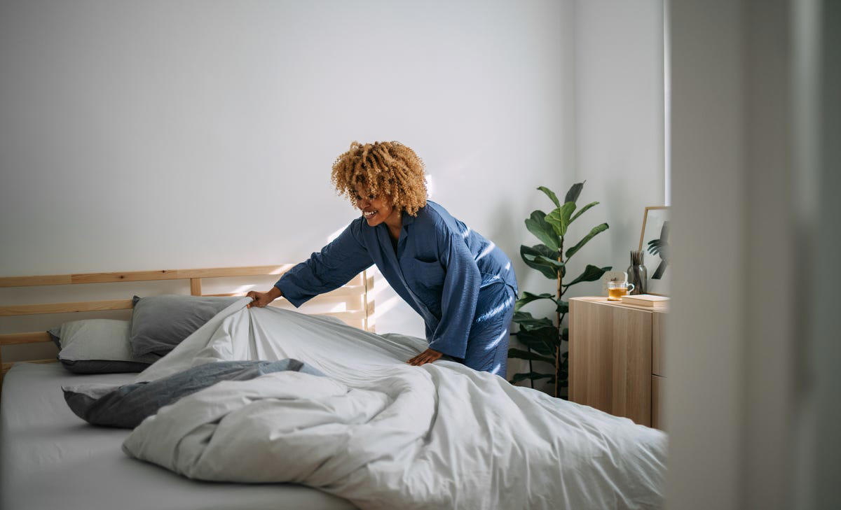 Make the bed (after it airs out), Wipe down the bathroom sink and counter, Wash down shower walls, Disinfect my phone and laptop, Spend a few minutes tidying up, Wipe the kitchen counter, Rinse the kitchen sink, Do a quick vacuum—starting in the kitchen, Clean the stovetop, Wipe kitchen table (or wherever you eat meals), Check inside the fridge