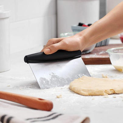 A bench scraper to keep their workspace tidy, A sous vide machine to cook proteins to perfection, A hosting gift for every palate, A KitchenAid stand mixer that puts in the elbow grease for you, A silicone baking mat to handle dough like a pro,  A magnetic meat thermometer for ultimate food safety and convenience, A giftable spice collection curated by chefs, An impressive set of Hedley &amp; Bennett knives , A Le Creuset pie dish too pretty to put away, A non-stick pan they’ll rely on for every meal, Related...