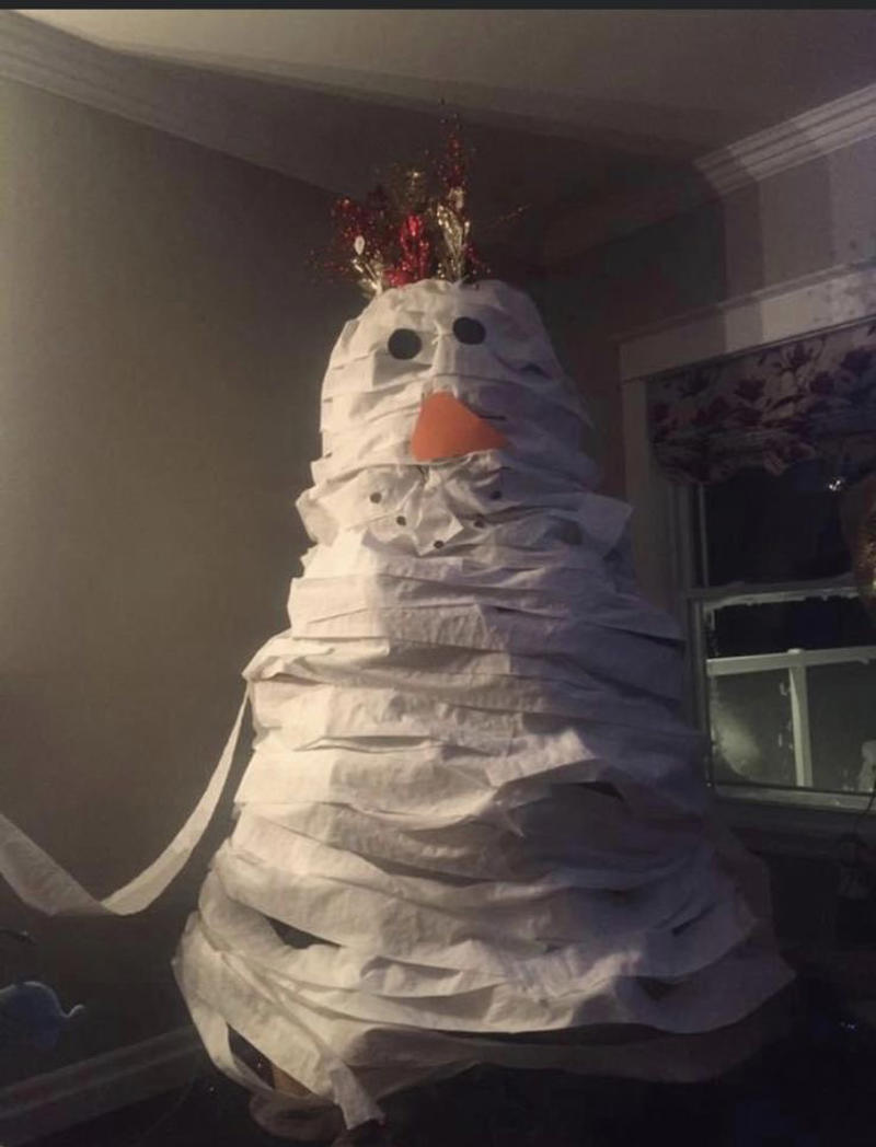 Indoor Snowman Made of Toilet Paper Weird Christmas Postcard, Girl Passed Out Under the Christmas Tree, Crying Kid on Santa’s Lap, Santa Writing “Merry Christmas” in Bathroom Graffiti, Santa Asleep on the Bed, Eating on the Floor With a Sad Christmas Tree, Santa Driving While Talking on the Phone, Santa Posing Like a Cool Kid, Sad Christmas Tree That’s Basically a Stick, Broom Used as a Christmas Tree, Santa Drinking Whisky at a Bar, Air Freshener Sticker Used as a Christmas Tree, Plunger Christmas Tree With Toilet Paper, Indoor Snowman Made of Toilet Paper, Christmas Tree Decorated With Toilet Paper Rolls