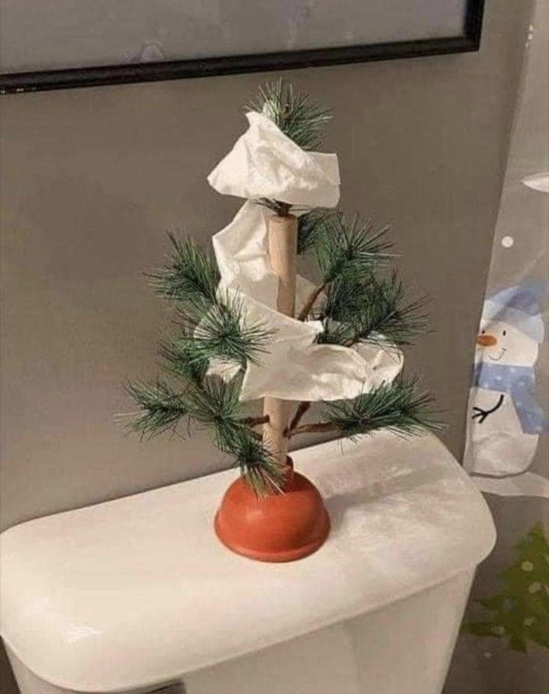 Plunger Christmas Tree With Toilet Paper Weird Christmas Postcard, Girl Passed Out Under the Christmas Tree, Crying Kid on Santa’s Lap, Santa Writing “Merry Christmas” in Bathroom Graffiti, Santa Asleep on the Bed, Eating on the Floor With a Sad Christmas Tree, Santa Driving While Talking on the Phone, Santa Posing Like a Cool Kid, Sad Christmas Tree That’s Basically a Stick, Broom Used as a Christmas Tree, Santa Drinking Whisky at a Bar, Air Freshener Sticker Used as a Christmas Tree, Plunger Christmas Tree With Toilet Paper, Indoor Snowman Made of Toilet Paper, Christmas Tree Decorated With Toilet Paper Rolls