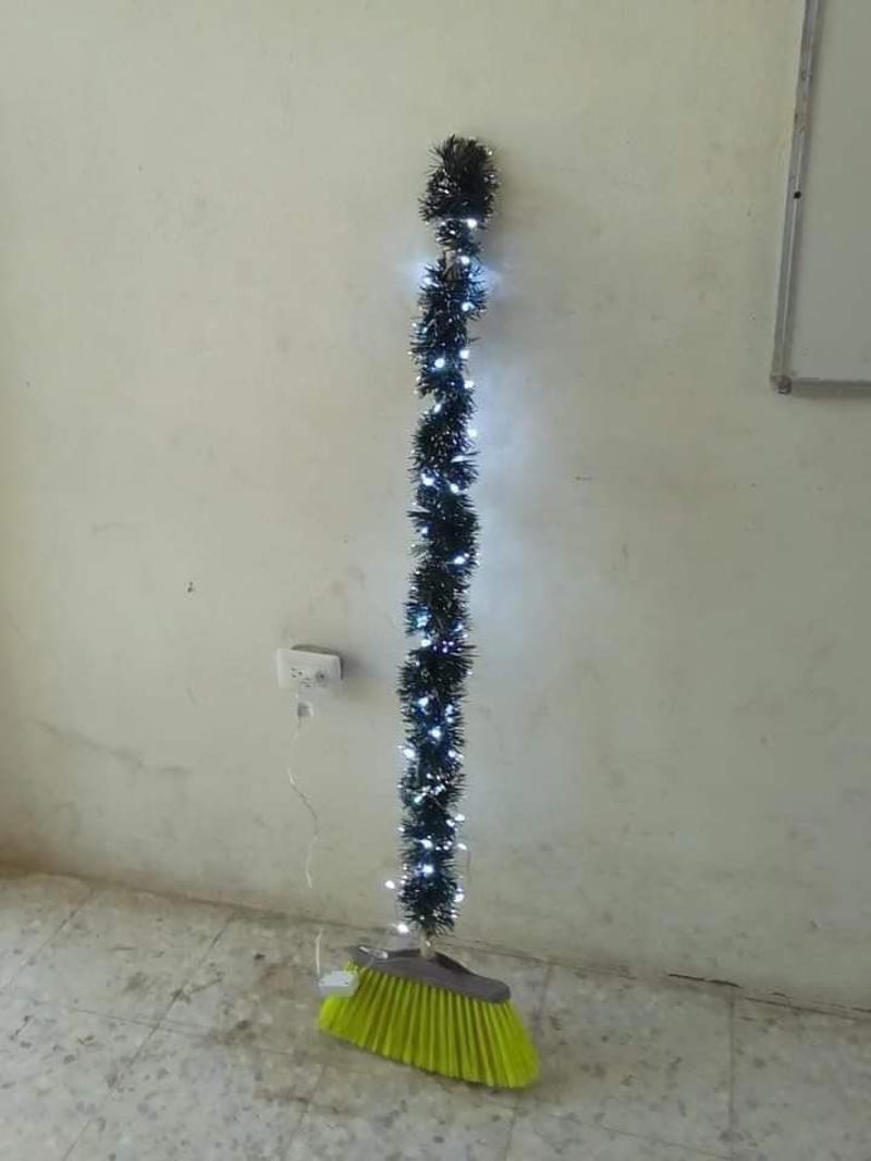 Broom Used as a Christmas Tree Weird Christmas Postcard, Girl Passed Out Under the Christmas Tree, Crying Kid on Santa’s Lap, Santa Writing “Merry Christmas” in Bathroom Graffiti, Santa Asleep on the Bed, Eating on the Floor With a Sad Christmas Tree, Santa Driving While Talking on the Phone, Santa Posing Like a Cool Kid, Sad Christmas Tree That’s Basically a Stick, Broom Used as a Christmas Tree, Santa Drinking Whisky at a Bar, Air Freshener Sticker Used as a Christmas Tree, Plunger Christmas Tree With Toilet Paper, Indoor Snowman Made of Toilet Paper, Christmas Tree Decorated With Toilet Paper Rolls