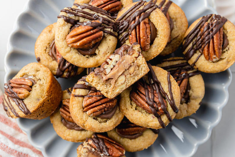 Thumbprint Cookies, Walnut Snowball Cookies, Giant Ginger Cookies, Peanut Butter Blossom Cookies, 3-Ingredient Macaroons, Almond Crescent Cookies, Red Velvet Cookies, Date Skillet Cookie, Pecan Tassies (Pecan Pie Cookies), Potato Chip Cookies, Oatmeal Lace Cookies, Turtle Cookie Cups, Marzipan Shortbread Cookies, White Chocolate Macadamia Nut Cookies, Brown Sugar Snickerdoodle Cookies, Butter Pecan Cookies