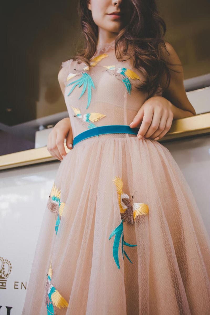 A flowing dress with sequins, A light A-line dress, A jersey dress, A fringed dress, A stretch cotton dress, A heavy satin mermaid dress, A ball gown with a petticoat, A strapless dress adorned with pearls, A tulle dress with a train, A form-fitting velvet dress