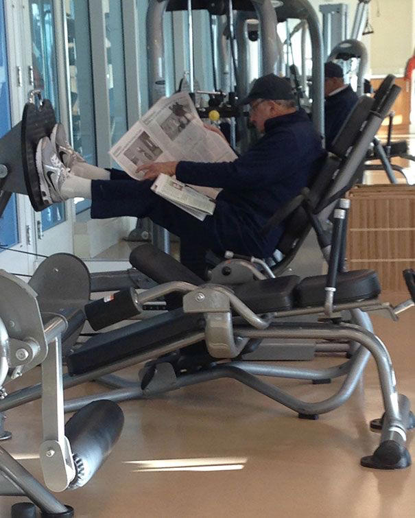 Reading the Newspaper on a Gym Machine, Man Using Gym Equipment Wrong, Guy Dressed Like Kill Bill at the Gym, Man Using an Exercise Ball in a Weird Way, Man Completely Confused by Gym Equipment, Man Reading the Newspaper, Old Lady Using Gym Machine Wrong, Guy Screaming While Exercising, Man Standing on Stacked Weights, Guy Bending Way Too Much While Lifting Weights, Woman Striking a Very Strange Pose, Weights on Her Back While on Her Phone, Woman Lying Down at the Gym Using Her Phone, Two-Wheel Scooter on a Treadmill, Woman Lying Down, Ignoring the Machine, Guy Carrying a Giant iPad on His Back, Full Cyclist Mode, Guy Eating at the Gym