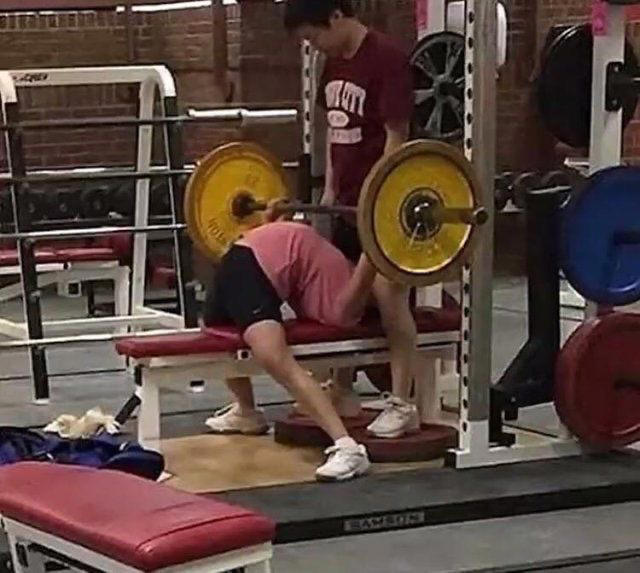 Reading the Newspaper on a Gym Machine, Man Using Gym Equipment Wrong, Guy Dressed Like Kill Bill at the Gym, Man Using an Exercise Ball in a Weird Way, Man Completely Confused by Gym Equipment, Man Reading the Newspaper, Old Lady Using Gym Machine Wrong, Guy Screaming While Exercising, Man Standing on Stacked Weights, Guy Bending Way Too Much While Lifting Weights, Woman Striking a Very Strange Pose, Weights on Her Back While on Her Phone, Woman Lying Down at the Gym Using Her Phone, Two-Wheel Scooter on a Treadmill, Woman Lying Down, Ignoring the Machine, Guy Carrying a Giant iPad on His Back, Full Cyclist Mode, Guy Eating at the Gym