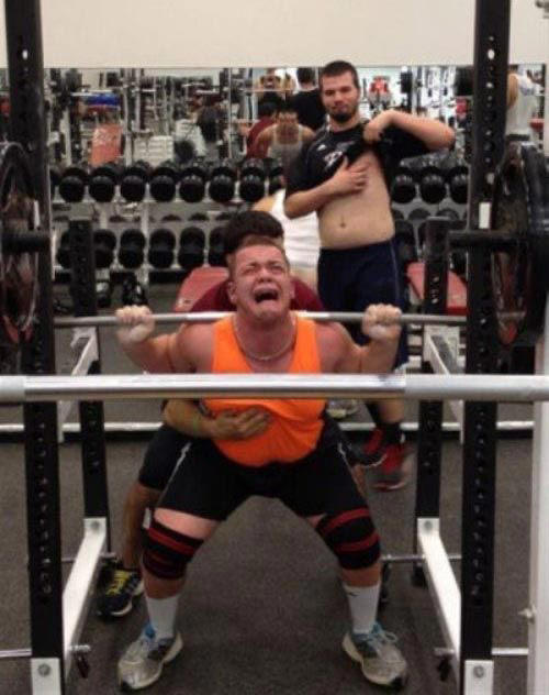 Reading the Newspaper on a Gym Machine, Man Using Gym Equipment Wrong, Guy Dressed Like Kill Bill at the Gym, Man Using an Exercise Ball in a Weird Way, Man Completely Confused by Gym Equipment, Man Reading the Newspaper, Old Lady Using Gym Machine Wrong, Guy Screaming While Exercising, Man Standing on Stacked Weights, Guy Bending Way Too Much While Lifting Weights, Woman Striking a Very Strange Pose, Weights on Her Back While on Her Phone, Woman Lying Down at the Gym Using Her Phone, Two-Wheel Scooter on a Treadmill, Woman Lying Down, Ignoring the Machine, Guy Carrying a Giant iPad on His Back, Full Cyclist Mode, Guy Eating at the Gym