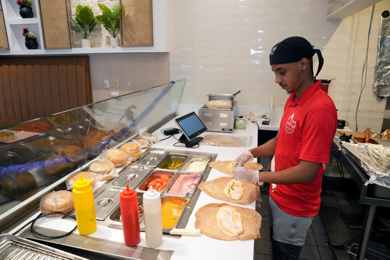 What are Ibrahim Almahaireh's Columbus restaurants?, Not giving up on his first career, Finding new fans of Middle Eastern food, 'My goal is to reach all of the people'