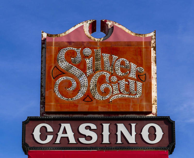 North Strip motel, Catholic church, Silver City Casino sign, Apartments behind Treasure Island, Jockey Club