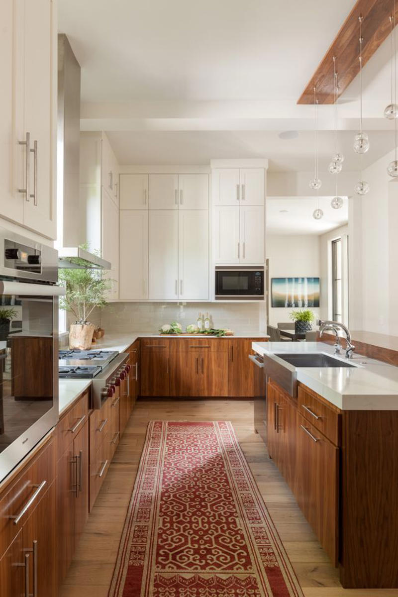 1. Cashmere Kitchens: Refined Warm Neutrals, 2. Wood Cabinetry, 3. Two-Tone Cabinetry, 4. Appliances in Bold Hues, 5. Nature-Inspired and Earth-Toned Backsplashes, 6. Cream and Beige Taj Mahal Countertops, 7. Mixed Metals, 8. Stainless Steel as a Design Statement, 9. Natural Stone Countertops, 10. Add Color and Texture with Mesh Insert Cabinetry