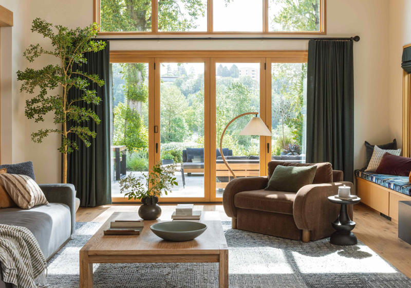 1. Traditional Window Treatment Designs, 2. Cafe Curtains: Hung on Their Own or Paired with Roman Shades, 3. Statement Drapery, 4. Outside Mounted Roman Shades, 5. Bronze Hardware, 6. Natural Woven Shades, 7. Layered Window Treatments