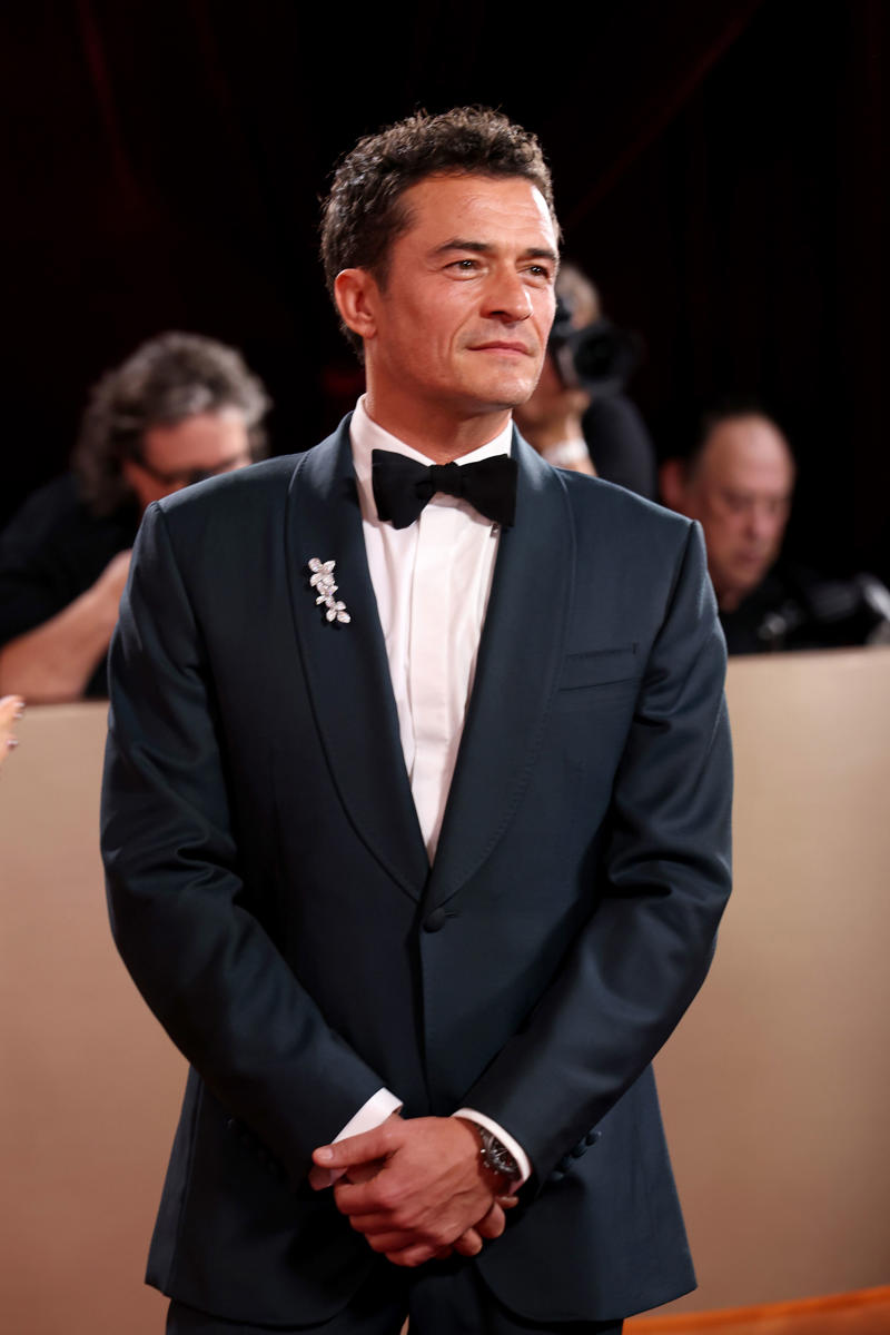 Stellan Skarsgård’s Omega Seamaster Aqua Terra Shades Moonshine Gold, Sterling K. Brown’s Audemars Piguet Royal Oak Perpetual Calendar, Timothée Chalamet’s Urban Jürgensen UJ-2, Chris Pine’s Cartier Tank Louis Cartier, Walton Goggins’ Cartier Tonneau, John Krasinski’s Glashütte Original Vintage Sixties, Colman Domingo’s Omega Speedmaster 38MM, Paul Mescal’s Cartier Tortue, Dwayne Johnson’s Chopard Alpine Eagle Frozen Summit, Jeremy Allen White’s Louis Vuitton Tambour, Wagner Moura’s Omega De Ville Trésor 40 mm, Jake Lacy’s Jaeger-LeCoultre Reverso Duoface Small Seconds, Glen Powell’s Omega Seamaster Aqua Terra 150M Moonshine Gold, Tramell Tillman’s Audemars Piguet Royal Oak “Jumbo” Extra-Thin Openworked, Oscar Isaac’s Bulgari Octo Finissimo, Marlon Wayans’ Omega Speedmaster Canopus Gold, Jacob Elordi’s Cartier Tank Normale, Adam Brody’s Jaeger-LeCoultre Reverso Tribute Monoface Small Seconds, Kumail Nanjiani’s Vacheron Constantin Overseas Perpetual Calendar Ultra-Thin, Orlando Bloom’s Porsche Design Chronograph 1 - 1975 Limited Edition, Benny Blanco’s Jacob & Co., Connor Storrie’s Tiffany & Co. Union Square, Leonardo DiCaprio’s Rolex Cosmograph Daytona “Le Mans”, Hudson Williams’ Bulgari Serpenti, Nick Jonas’s Fossil Carraway, George Clooney’s Omega Seamaster Aqua Terra 150M, Dylan Efron’s TAG Heuer Carrera Astronomer 39mm, Luke Grimes’ Blancpain Villeret Quantième Complet