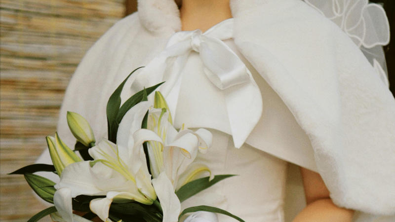 6. Cape Moment 1. Short and Chic, 2. Bridal Jumpsuit, 3. Two-Piece Set, 4. Colored Gown, 5. Black Bridal Look, 6. Cape Moment, 7. Detachable Overskirt, 8. Statement Sleeves, 9. High Neckline, 10. Deep V Drama, 11. Open-Back Stunner, 12. Sheer Illusion Details, 13. Corset Bodice, 14. Slip Dress, 15. Feather Accents, 16. Metallic Shine, 17. Floral 3D Appliqué, 18. Opt For The Tux, 19. Dramatic Train, 20. Vintage-Inspired Twist