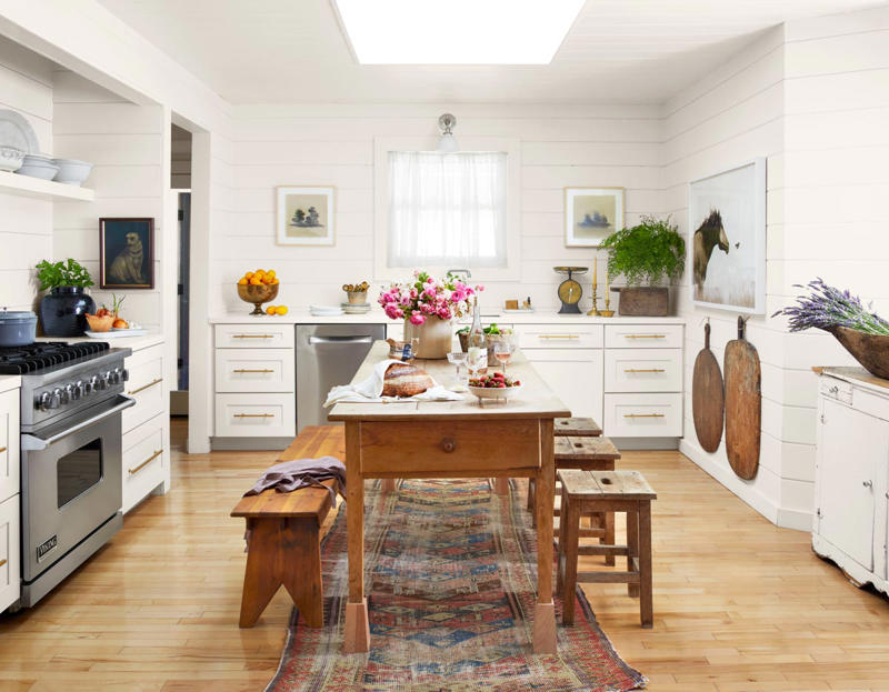 Boring Can Lights, Too Many Materials , A Big, Bulky Built-In Island, Two-Toned Cabinetry, Upper Cabinets, Ho-Hum Countertops , Countertop Drying Racks
