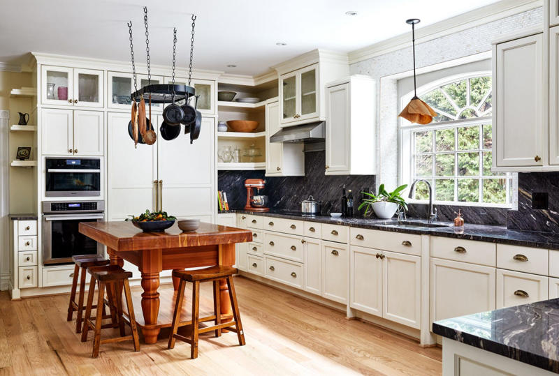 Boring Can Lights, Too Many Materials , A Big, Bulky Built-In Island, Two-Toned Cabinetry, Upper Cabinets, Ho-Hum Countertops , Countertop Drying Racks