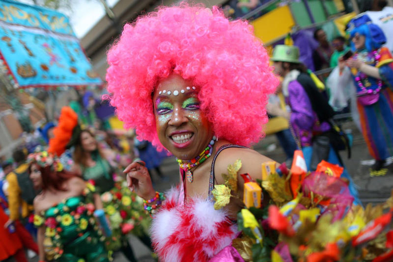 Fat Tuesday , Bead Throwing, Rex, the King of the Carnival, Purple, Gold, and Green, King Cake, Zulu Coconuts, Flambeaux, Worldwide Revelry