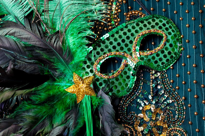 Fat Tuesday , Bead Throwing, Rex, the King of the Carnival, Purple, Gold, and Green, King Cake, Zulu Coconuts, Flambeaux, Worldwide Revelry