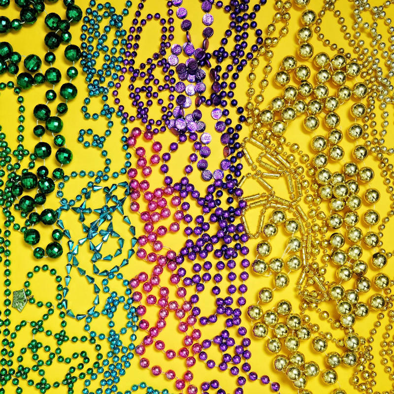 Fat Tuesday , Bead Throwing, Rex, the King of the Carnival, Purple, Gold, and Green, King Cake, Zulu Coconuts, Flambeaux, Worldwide Revelry