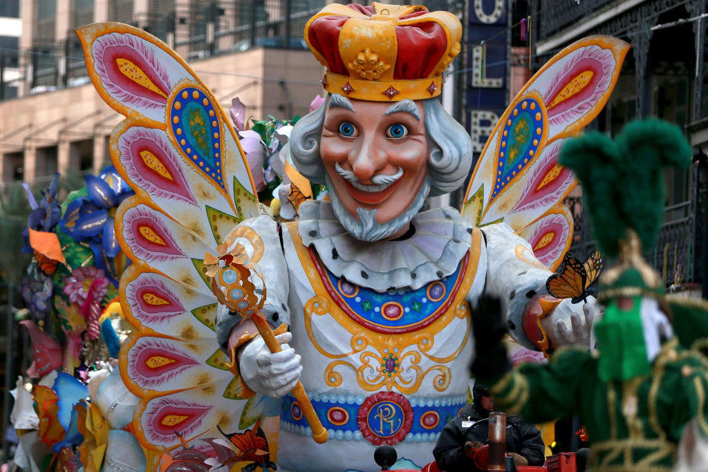Fat Tuesday , Bead Throwing, Rex, the King of the Carnival, Purple, Gold, and Green, King Cake, Zulu Coconuts, Flambeaux, Worldwide Revelry