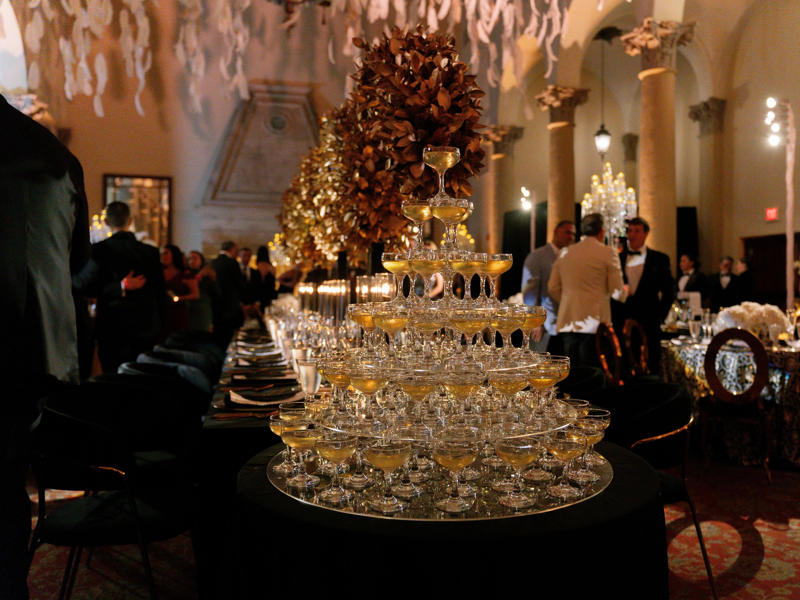 The ballroom inside can hold up to 700 people and has welcomed presidents and royals. Today, the hotel is loved by high-profile figures., Inside, the hotel has kept its original, century-old lobby., The lobby decorations match the hotel's historic, elevated vibe., The lobby also serves as a dining area for afternoon tea., Downstairs, the hotel's Fontana restaurant partially sits in an open-air courtyard., Fontana serves Italian-inspired dishes., Brandi's, the hotel's dark, moody bar, draws inspiration from the Biltmore's past., At the 600-gallon pool, there's poolside dining and nine private cabanas., The Biltmore's clubhouse is the center of events at the property., Next to the course are spaces for relaxing and socializing., Tucked in the clubhouse, there's also a members-only lounge.