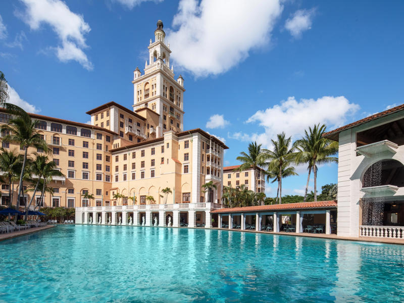 Whether it's to golf, ghost-hunt, or retreat, the Biltmore welcomes guests just like it did 100 years ago. Today, the hotel is loved by high-profile figures., Inside, the hotel has kept its original, century-old lobby., The lobby decorations match the hotel's historic, elevated vibe., The lobby also serves as a dining area for afternoon tea., Downstairs, the hotel's Fontana restaurant partially sits in an open-air courtyard., Fontana serves Italian-inspired dishes., Brandi's, the hotel's dark, moody bar, draws inspiration from the Biltmore's past., At the 600-gallon pool, there's poolside dining and nine private cabanas., The Biltmore's clubhouse is the center of events at the property., Next to the course are spaces for relaxing and socializing., Tucked in the clubhouse, there's also a members-only lounge.