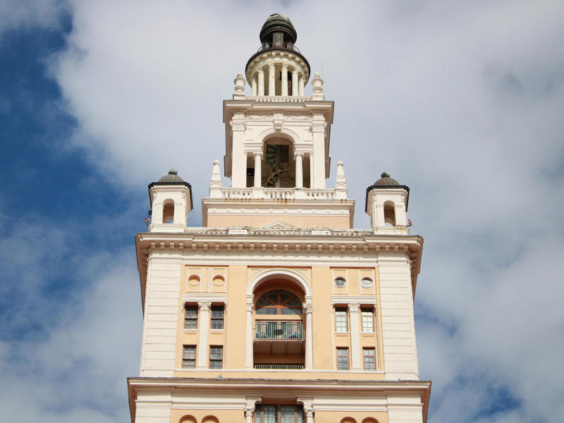 The tallest point of the hotel's iconic tower is home to its two luxurious presidential suites. Today, the hotel is loved by high-profile figures., Inside, the hotel has kept its original, century-old lobby., The lobby decorations match the hotel's historic, elevated vibe., The lobby also serves as a dining area for afternoon tea., Downstairs, the hotel's Fontana restaurant partially sits in an open-air courtyard., Fontana serves Italian-inspired dishes., Brandi's, the hotel's dark, moody bar, draws inspiration from the Biltmore's past., At the 600-gallon pool, there's poolside dining and nine private cabanas., The Biltmore's clubhouse is the center of events at the property., Next to the course are spaces for relaxing and socializing., Tucked in the clubhouse, there's also a members-only lounge.