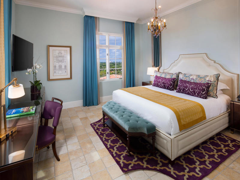 Guests staying in the hotel's standard rooms can expect decor that pays homage to its past. Today, the hotel is loved by high-profile figures., Inside, the hotel has kept its original, century-old lobby., The lobby decorations match the hotel's historic, elevated vibe., The lobby also serves as a dining area for afternoon tea., Downstairs, the hotel's Fontana restaurant partially sits in an open-air courtyard., Fontana serves Italian-inspired dishes., Brandi's, the hotel's dark, moody bar, draws inspiration from the Biltmore's past., At the 600-gallon pool, there's poolside dining and nine private cabanas., The Biltmore's clubhouse is the center of events at the property., Next to the course are spaces for relaxing and socializing., Tucked in the clubhouse, there's also a members-only lounge.