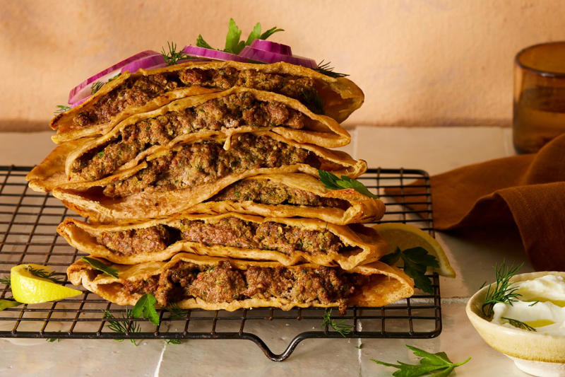 Grilled Burgers Stuffed with Pimiento Cheese, Super-Fast Classic Lasagna, Classic Meatloaf, Picadillo, Classic Beef Chili, Patty Melts with Charred Scallion–Chipotle Mayo, Beef and Cheese Red Chile Enchiladas, Bolognese Meat Sauce, Mini Potato, Steak, and Chorizo Pies, Ground Beef Bulgogi Sloppy Joes with Fiery Napa Slaw, Ground Beef Lasagna, Juicy Lucy Cheeseburger, Beef-and-Fonio Meatballs with Sweet Potato Stew, Lamb and Beef Burek, Poblanos Rellenos de Picadillo Dulce, Frito Pie, Gina Mae's Baked Beans, Baked Shells with Pesto, Mozzarella, and Meat Sauce, Japanese-Style Chili Burgers with Yuzu Mayo, Sogogi Oi Bokkeum (Korean Stir-Fried Cucumber and Beef), Tex-Mex Cavatappi, Grilled Meatballs with Mint and Za'atar, Garlic Beef and Onion Congee, Hamburger Helpa, Beef Keema, Mini Panamanian Beef Empanadas, Spiced Harissa Ragù with Tahini Yogurt, Beef and Vegetable Pot Pie with Cheddar Biscuits, Nachos in a Bag, Soboro Donburi (Gingery Ground Beef with Peas over Rice), Taco Dip, Hungarian Beef and Potato Soup, Thai-Style Beef Salad Over Angel Hair Pasta