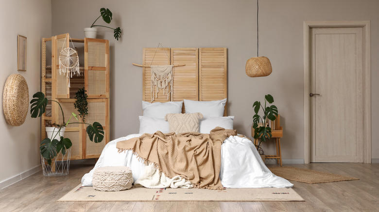 Accent wall, Unique artwork, Soft fabrics, Graphic murals, Repurposed home decor, Practical shelving, Found objects, Thrifted finds, Reflective mirror, Old doors, Pillows, pillows, and more pillows