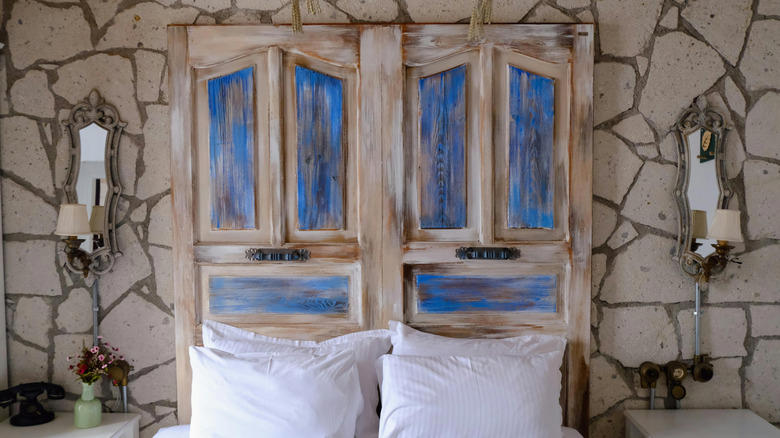 Accent wall, Unique artwork, Soft fabrics, Graphic murals, Repurposed home decor, Practical shelving, Found objects, Thrifted finds, Reflective mirror, Old doors, Pillows, pillows, and more pillows