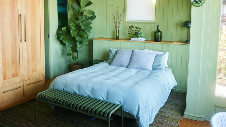 Accent wall, Unique artwork, Soft fabrics, Graphic murals, Repurposed home decor, Practical shelving, Found objects, Thrifted finds, Reflective mirror, Old doors, Pillows, pillows, and more pillows