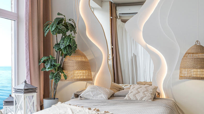 Accent wall, Unique artwork, Soft fabrics, Graphic murals, Repurposed home decor, Practical shelving, Found objects, Thrifted finds, Reflective mirror, Old doors, Pillows, pillows, and more pillows