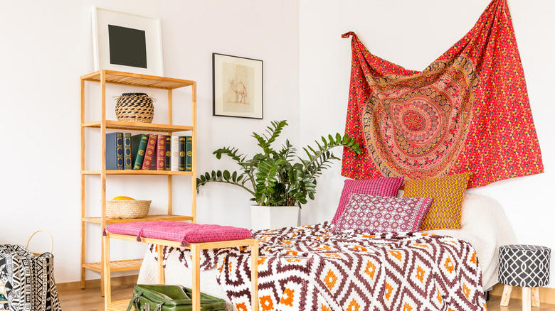 Accent wall, Unique artwork, Soft fabrics, Graphic murals, Repurposed home decor, Practical shelving, Found objects, Thrifted finds, Reflective mirror, Old doors, Pillows, pillows, and more pillows