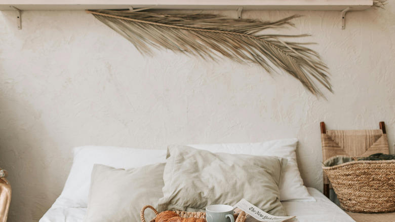 Accent wall, Unique artwork, Soft fabrics, Graphic murals, Repurposed home decor, Practical shelving, Found objects, Thrifted finds, Reflective mirror, Old doors, Pillows, pillows, and more pillows