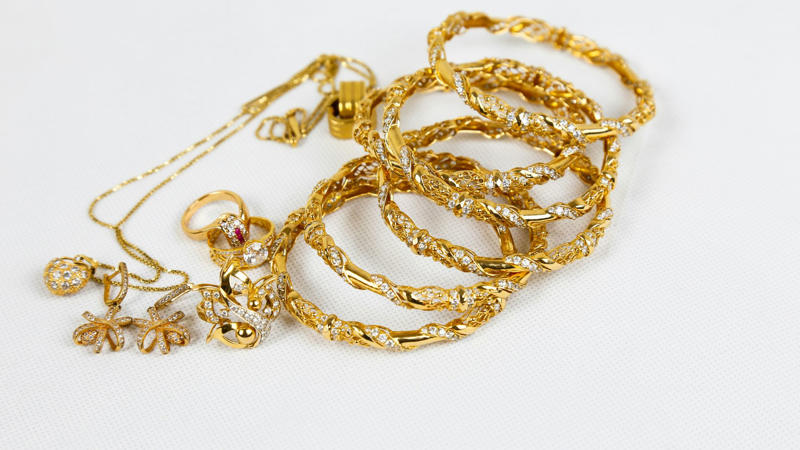 1. Classic Gold Hoop Earrings, 2. A Delicate Gold Chain Necklace, 3. Gold Stud Earrings, 4. A Gold Pendant Necklace, 5. A Gold Cuff Bracelet, 6. A Gold Signet Ring, 7. A Gold Layered Necklace Set, 8. A Gold Anklet, 9. A Gold Watch, 10. A Gold Chain Bracelet, 1. Sculptural Drop Earrings, 2. A Wide Gold Bangle, 3. A Gold Collar Necklace, 4. Statement Pearl-and-Gold Earrings, 5. A Chunky Gold Chain Necklace, 6. A Gold Cocktail Ring, 7. A Gold Brooch or Pin, 8. Gold Ear Cuffs, 9. A Two-Tone Gold Necklace, 10. A Gold Hair Accessory