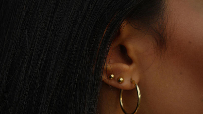 1. Classic Gold Hoop Earrings, 2. A Delicate Gold Chain Necklace, 3. Gold Stud Earrings, 4. A Gold Pendant Necklace, 5. A Gold Cuff Bracelet, 6. A Gold Signet Ring, 7. A Gold Layered Necklace Set, 8. A Gold Anklet, 9. A Gold Watch, 10. A Gold Chain Bracelet, 1. Sculptural Drop Earrings, 2. A Wide Gold Bangle, 3. A Gold Collar Necklace, 4. Statement Pearl-and-Gold Earrings, 5. A Chunky Gold Chain Necklace, 6. A Gold Cocktail Ring, 7. A Gold Brooch or Pin, 8. Gold Ear Cuffs, 9. A Two-Tone Gold Necklace, 10. A Gold Hair Accessory