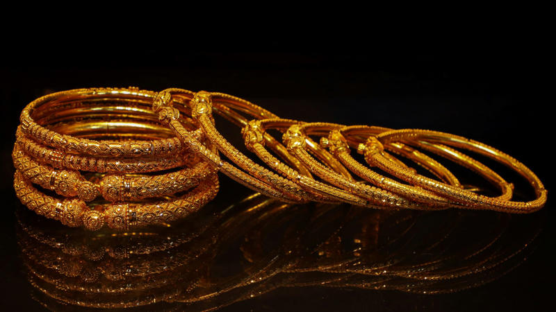1. Classic Gold Hoop Earrings, 2. A Delicate Gold Chain Necklace, 3. Gold Stud Earrings, 4. A Gold Pendant Necklace, 5. A Gold Cuff Bracelet, 6. A Gold Signet Ring, 7. A Gold Layered Necklace Set, 8. A Gold Anklet, 9. A Gold Watch, 10. A Gold Chain Bracelet, 1. Sculptural Drop Earrings, 2. A Wide Gold Bangle, 3. A Gold Collar Necklace, 4. Statement Pearl-and-Gold Earrings, 5. A Chunky Gold Chain Necklace, 6. A Gold Cocktail Ring, 7. A Gold Brooch or Pin, 8. Gold Ear Cuffs, 9. A Two-Tone Gold Necklace, 10. A Gold Hair Accessory