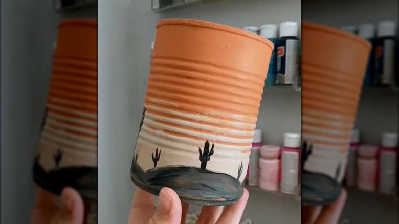 Repurpose a soup can into an adorable planter, Craft metal luminaries from empty soup cans, Transform a metal can into a unique bathroom vase, Make soup cans into chic, vintage-inspired desk organizers, Design a shabby chic carrying caddy from soup containers, Turn a ribbed can into a utensil crock, Decoupage metal cans into labeled pencil holders, Collect cans to make a wind chime, Hang a soup can as a basic bird feeder, Craft farmhouse decor with a smashed soup can, Transform a tin can into a nautical vase for coastal decor, Build a portable tool case out of metal cans, DIY an industrial wine rack from tin cylinders, Create festive tin can streamers