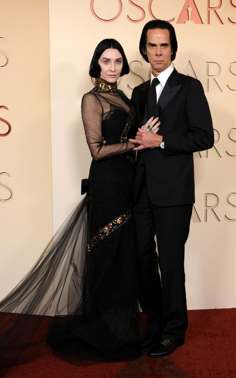 Susie and Nick Cave Oscars 2026, Jane Fonda, Sarah Pidgeon in Calvin Klein, Olivia Rodrigo in Saint Laurent, Naomi Watts in Balenciaga, Monica Lewinsky in Oscar de la Renta, Kim Kardashian in Gucci, Wendi Deng Murdoch and Grace Murdoch, Minnie Driver, Nicole Kidman, Marisa Abela in Revolve, Zoe Saldana in Saint Laurent, Helen Hunt in Stella McCartney, Hailey Bieber in Giorgio Armani, Kaia Gerber in Givenchy, Colman Domingo in Jacquemus, Philippine Leroy-Beaulieu, Sir Mick Jagger and Melanie Hamrick, Jeff Goldblum and Emilie Livingston in ERL Artisanal, Cara Delevingne in Thom Browne, Karlie Kloss in Gucci, Anjelica Huston, Sarah Paulson and Holland Taylor, Leslie Mann, Meg Ryan, Lauren Sanchez Bezos and Jeff Bezos, Tracee Ellis Ross in Marine Serre, Dree Hemingway in Conner Ives, Isla Fisher in Yara Shoemaker, Jessica Alba in Tamara Ralph, Kris Jenner in vintage Valentino, Rachel Sennott in Balenciaga, Dua Lipa and Callum Turner, Kristen Wiig in Monse, Elle and Dakota Fanning, Simone Ashley, Laura Harrier in Gucci, Kendall Jenner in Chanel, Grace Gummer, Mamie Gummer, Louisa Jacobson in Khaite, Suki Waterhouse and Robert Pattinson, Rita Ora in Tamara Ralph, Jessie Buckley in Chanel, Nicole Kidman in Chanel, Rose Byrne in Dior, Teyana Taylor in Chanel, Renate Reinsve in Louis Vuitton, Timothée Chalamet in Givenchy, Kylie Jenner in Schiaparelli, Demi Moore in Gucci, Gwyneth Paltrow in Armani Privé, Michael B. Jordan in Louis Vuitton, Zendaya and Robert Pattinson, Emma Stone in Louis Vuitton, Kate Hudson and Goldie Hawn, Chase Infiniti in Louis Vuitton, Felicity Jones in Prada, Anne Hathaway in Valentino, Odessa A’zion in Valentino, Wunmi Mosaku in Louis Vuitton, Elle Fanning in Givenchy, Kirsten Dunst and Jesse Plemons, Amy Madigan in Dior, Zoe Saldaña in Saint Laurent, Mia Goth in Dior, Paul Mescal and Gracie Abrams, Inga Ibsdotter Lilleaas in Loewe, Mikey Madison in Dior, Rachel McAdams in Alberta Ferretti, Mckenna Grace, Pedro Pascal in Chanel, Barbie Ferreira in GapStudio, Adrien Brody in Gucci, Jacob Elordi in Bottega Veneta, Charithra Chandran in Miss Sohee, EJAE in Dior, Audrey Nuna in Thom Browne, Rei Ami in Rahul Mishra, Huma Abedin and Anna Wintour, Leonardo DiCaprio in Dior, Kate Hawley, Damson Idris in Prada, Sigourney Weaver in Valentino, Alana Haim in Louis Vuitton, Heidi Klum, Hudson Williams in Balenciaga, Alicia Silverstone, Channing Tatum in Versace, Kathy Bates, Chloe Zhao, Joel Edgerton, Misty Copeland in David Koma, Maya Rudolph in Chanel, Ava DuVernay in Louis Vuitton, Anna Wintour, Benicio Del Toro in Giorgio Armani, Usher in Giuliva Heritage, Melissa McCarthy, Jack O’Connell in Dunhill, Lola Kirke in Simone Rocha, Fran Drescher in Ami, Jason Bateman in Dunhill, Ariana Greenblatt in John Galliano, Stellan Skarsgård, Kristen Wiig in Elie Saab, Jacobi Jupe, Kieran Culkin in Paul Smith, Nick Jonas and Priyanka Chopra Jonas, Wagner Moura in Zegna, Conan O’Brien, Vicky Krieps in Bottega Veneta, Ethan Hawke, Shaboozey in Campillo, Spike Lee, Joe Alwyn in Valentino, Kevin O’Leary, Ryan Destiny in Ami, Javier Bardem, Mark Strong in Giorgio Armani, Felix Kammerer in Saint Laurent, Ginnifer Goodwin in Monse, Susie and Nick Cave, Amelia Dimoldenberg in Ralph Lauren, Manu Rios in Saint Laurent