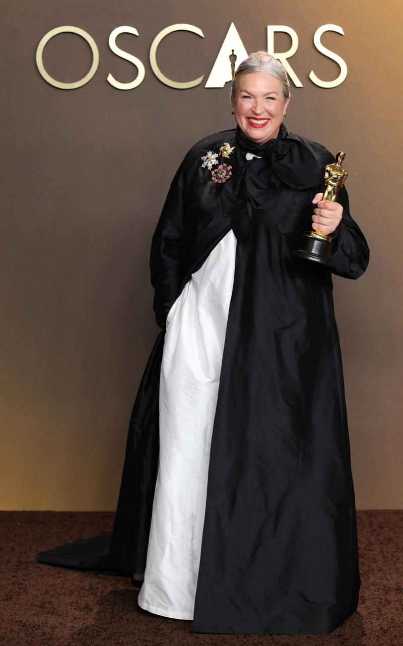 Kate Hawley Oscars 2026, Jane Fonda, Sarah Pidgeon in Calvin Klein, Olivia Rodrigo in Saint Laurent, Naomi Watts in Balenciaga, Monica Lewinsky in Oscar de la Renta, Kim Kardashian in Gucci, Wendi Deng Murdoch and Grace Murdoch, Minnie Driver, Nicole Kidman, Marisa Abela in Revolve, Zoe Saldana in Saint Laurent, Helen Hunt in Stella McCartney, Hailey Bieber in Giorgio Armani, Kaia Gerber in Givenchy, Colman Domingo in Jacquemus, Philippine Leroy-Beaulieu, Sir Mick Jagger and Melanie Hamrick, Jeff Goldblum and Emilie Livingston in ERL Artisanal, Cara Delevingne in Thom Browne, Karlie Kloss in Gucci, Anjelica Huston, Sarah Paulson and Holland Taylor, Leslie Mann, Meg Ryan, Lauren Sanchez Bezos and Jeff Bezos, Tracee Ellis Ross in Marine Serre, Dree Hemingway in Conner Ives, Isla Fisher in Yara Shoemaker, Jessica Alba in Tamara Ralph, Kris Jenner in vintage Valentino, Rachel Sennott in Balenciaga, Dua Lipa and Callum Turner, Kristen Wiig in Monse, Elle and Dakota Fanning, Simone Ashley, Laura Harrier in Gucci, Kendall Jenner in Chanel, Grace Gummer, Mamie Gummer, Louisa Jacobson in Khaite, Suki Waterhouse and Robert Pattinson, Rita Ora in Tamara Ralph, Jessie Buckley in Chanel, Nicole Kidman in Chanel, Rose Byrne in Dior, Teyana Taylor in Chanel, Renate Reinsve in Louis Vuitton, Timothée Chalamet in Givenchy, Kylie Jenner in Schiaparelli, Demi Moore in Gucci, Gwyneth Paltrow in Armani Privé, Michael B. Jordan in Louis Vuitton, Zendaya and Robert Pattinson, Emma Stone in Louis Vuitton, Kate Hudson and Goldie Hawn, Chase Infiniti in Louis Vuitton, Felicity Jones in Prada, Anne Hathaway in Valentino, Odessa A’zion in Valentino, Wunmi Mosaku in Louis Vuitton, Elle Fanning in Givenchy, Kirsten Dunst and Jesse Plemons, Amy Madigan in Dior, Zoe Saldaña in Saint Laurent, Mia Goth in Dior, Paul Mescal and Gracie Abrams, Inga Ibsdotter Lilleaas in Loewe, Mikey Madison in Dior, Rachel McAdams in Alberta Ferretti, Mckenna Grace, Pedro Pascal in Chanel, Barbie Ferreira in GapStudio, Adrien Brody in Gucci, Jacob Elordi in Bottega Veneta, Charithra Chandran in Miss Sohee, EJAE in Dior, Audrey Nuna in Thom Browne, Rei Ami in Rahul Mishra, Huma Abedin and Anna Wintour, Leonardo DiCaprio in Dior, Kate Hawley, Damson Idris in Prada, Sigourney Weaver in Valentino, Alana Haim in Louis Vuitton, Heidi Klum, Hudson Williams in Balenciaga, Alicia Silverstone, Channing Tatum in Versace, Kathy Bates, Chloe Zhao, Joel Edgerton, Misty Copeland in David Koma, Maya Rudolph in Chanel, Ava DuVernay in Louis Vuitton, Anna Wintour, Benicio Del Toro in Giorgio Armani, Usher in Giuliva Heritage, Melissa McCarthy, Jack O’Connell in Dunhill, Lola Kirke in Simone Rocha, Fran Drescher in Ami, Jason Bateman in Dunhill, Ariana Greenblatt in John Galliano, Stellan Skarsgård, Kristen Wiig in Elie Saab, Jacobi Jupe, Kieran Culkin in Paul Smith, Nick Jonas and Priyanka Chopra Jonas, Wagner Moura in Zegna, Conan O’Brien, Vicky Krieps in Bottega Veneta, Ethan Hawke, Shaboozey in Campillo, Spike Lee, Joe Alwyn in Valentino, Kevin O’Leary, Ryan Destiny in Ami, Javier Bardem, Mark Strong in Giorgio Armani, Felix Kammerer in Saint Laurent, Ginnifer Goodwin in Monse, Susie and Nick Cave, Amelia Dimoldenberg in Ralph Lauren, Manu Rios in Saint Laurent